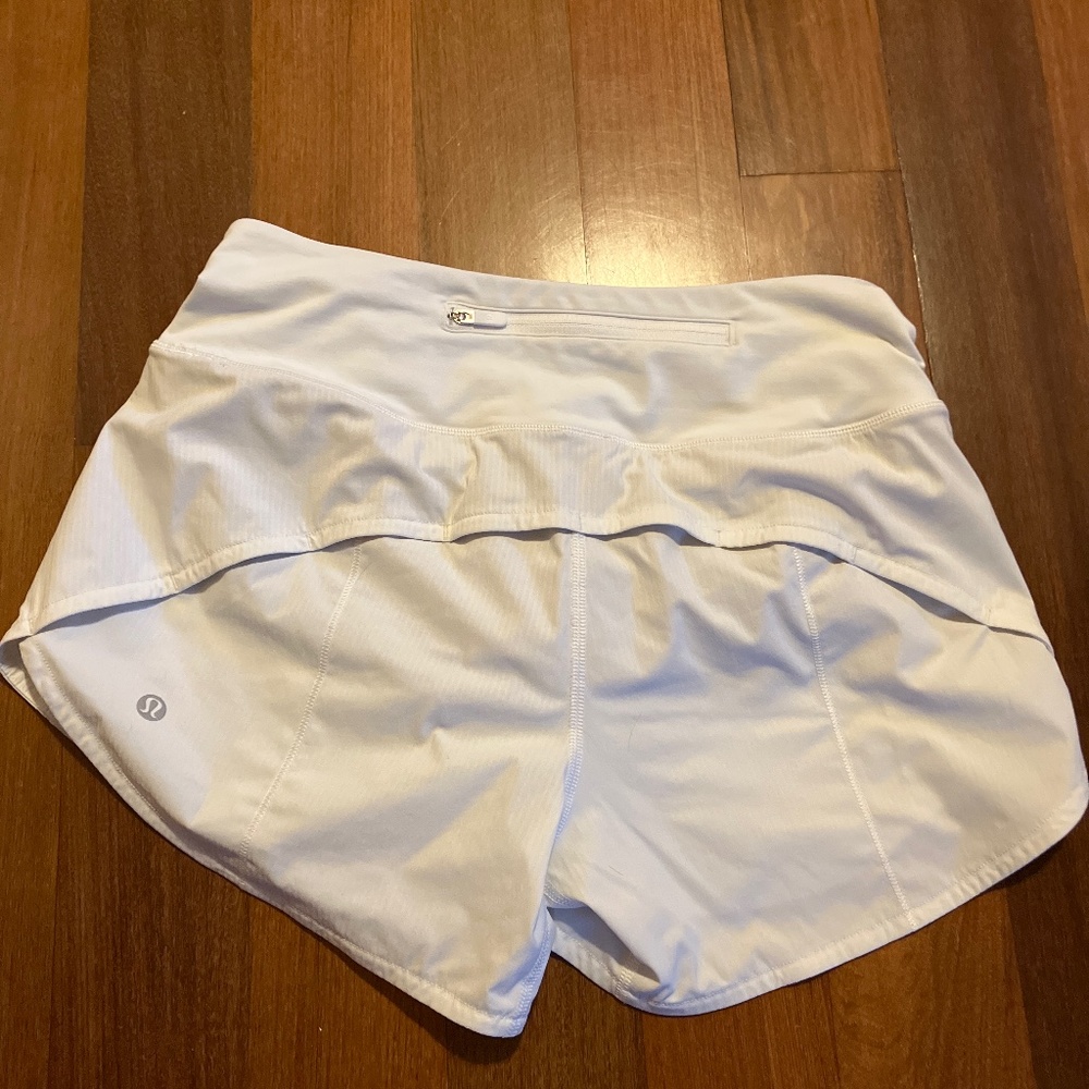 white lululemon speed up shorts size 4 4”